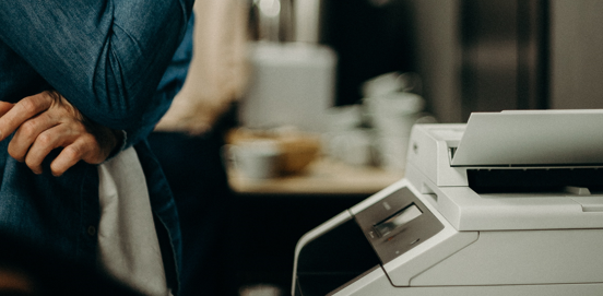 Person waiting for documents from printer